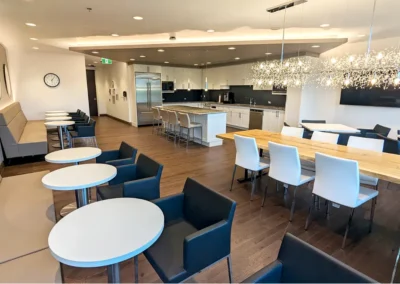 Base5 Office Toronto, Ontario Custom millwork detailing solutions that seamlessly integrate functional cabinetry, appliance accommodation, and optimized storage across key spaces including the pantry, reception desk, and office storage areas.